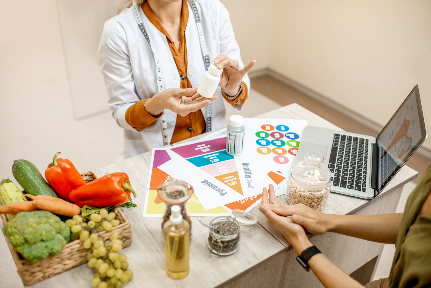 Nutritionist with Female Client at the Office